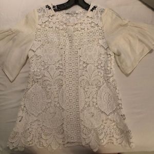 White stitched detailed with bold sleeves